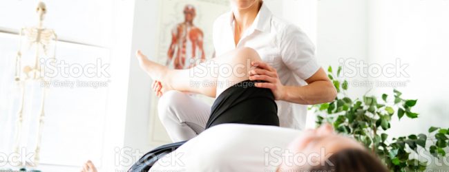 Modern rehabilitation physiotherapy woman worker with client